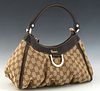 Gucci D-Ring Hobo, in beige and brown monogrammed canvas with brown leather accents and gold hardware, opening to a brown canvas lined interior with z