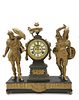 Ansonia Gilt metal figural mantle clock The Gilt metal chiming clock is raised on a footed base, the round movement with winding holes and adorsed fem