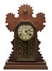 19th century American mantle clock 19th century American gingerbread mantle clock with chime
Approx 22" h x 14-1/2" w x 5" d
Not tested, (as is) con