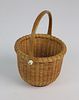 Susan Chase One-Egg Round Open Swing Handle Basket, circa 1977