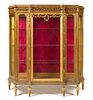 A Louis XVI Style Giltwood Vitrine Cabinet Height 62 1/2 x width 56 1/2 x depth 16 inches.