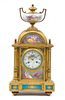 * A Louis XVI Style Porcelain Mounted Gilt Bronze Mantle Clock Height 15 inches.