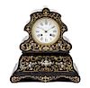 * A French Brass and Mother-of-Pearl Inlaid Mantle Clock Height 12 inches.