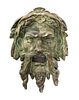 * A Neoclassical Patinated Cast Stone Mask Height 16 inches.