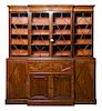 A Regency Style Mahogany Breakfront Bookcase Width 81 1/2 inches.