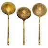 * Three Russian Silver-Gilt Serving Spoons, Marks of S. Stroganov, Stepan Levin and GAC, Moscow, 19th century, each having a twi