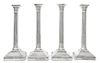 A Set of Four English Silver-Plate Candlesticks, Maker's mark obscured, each of Corinthian columnar form, raised on a stepped ba