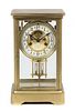 A Brass and Glass Regulator Clock Height 10 3/4 inches.