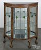 Mahogany bowfront china cabinet, early 20th c., with leaded glass panels, 48'' h., 40'' w.