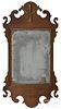 Chippendale walnut looking glass, late 18th c., with an applied gilt feather crest, 23'' h.
