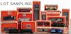 Contemporary Lionel O gauge train cars, engine, and accessories, all in their original boxes