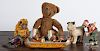 Three tin wind-up toys, to include Native American Indians in a canoe, 8'' l.