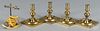Four English brass candlesticks, 19th c., 5'' h., together with a wax jack, 5 1/2'' h.