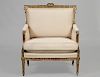 LOUIS XVI STYLE CARVED AND GILTWOOD BERGERE BY ALEXANDER PIHOUEE