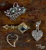 Three antique pins, to include a silver flower basket brooch accented with rose cut diamonds