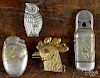 Four figural match vesta safes, ca. 1900, to include a rooster, an owl, a bird hatching from an egg