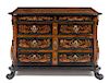 * An Italian Baroque Walnut and Marquetry Chest of Drawers Height 39 1/2 x width 58 x depth 27 inches.