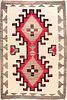 A CIRCA 1940 NAVAJO RUG WITH LARGE CENTRAL MEDALLION
