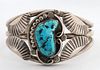 A NAVAJO STERLING SILVER AND TURQUOISE CUFF BRACELET