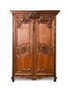 A Louis XV Provincial Oak Armoire Height 92 x width 57 x depth 26 inches.