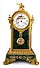 A Neoclassical Gilt Bronze and Malachite Mantel Clock Height 21 1/2 inches.