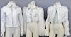 Three women's white designer jackets including Moschino short jacket with fur collar and arms of long alpaca hair, white leather jacket, and a Strenes