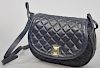 Judith Leiber quilted navy blue leather purse with red interior, 7 1/2" x 10 1/2" x 2 1/2"