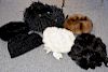Six hats including three Kokin and Givenchy white mink, a black mink, and a brown mink.