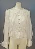 Chanel off-white blouse with ruffled edges, new with tag retail $3,900 RTW (size 38).