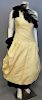 Christian Dior, Autumn/Winter 1982, Evening dress of yellow silk moire, one-shoulder, with dropped waist and bubble skirt. Trimmed around neckline and