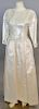 Chanel ivory silk satin evening gown with sequined flower top and long sleeves.