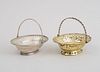 GEORGE III CRESTED SILVER SWEETMEAT BASKET AND A GEORGE III SILVER-GILT SWEETMEAT BASKET
