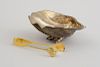 CONTINENTAL SILVERED METAL SHELL-FORM DISH AND A PAIR OF ITALIAN STERLING (925) SILVER-GILT ICE TONGS