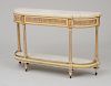PAIR OF LOUIS XVI STYLE ORMOLU-MOUNTED CREAM-PAINTED AND PARCEL-GILT CONSOLES