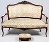 FRENCH CARVED WALNUT SETTEE AND FOOTSTOOL