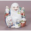 A Chinese Porcelain Figure of Buddha with Five Children, 20th Century.