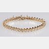 A 14kt. Yellow Gold and Diamond 'S Link' Bracelet,