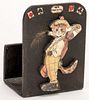 Trump Indicator and Deck Holder. Circa 1930. Wood cat trump indicator and double deck holder. Cat dressed in golf togs, toting a golf bag. Overall ver