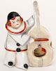 Trump Indicator Clown Playing Bass Violin. Circa 1930. Porcelain figure of clown playing bass violin. Made in either Japan or Germany. Excellent.
