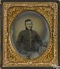 Civil War ambrotype of a Union soldier, ca. 1863, seated with his kepi resting on a side table