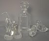 Five piece crystal lot to include four Steuben figures, two small birds, snail (as is), and a bird along with a Baccarat decanter