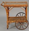 Wicker tea cart with glass tray top. ht. 31 1/2", lg. 31"