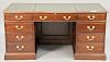 Stickley cherry desk with tooled leather top. ht. 31", top: 32" x 62"
