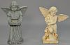 Three large outdoor angels including iron angel holding flowers, seated putti figure and a standing girl angel