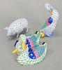 Three Herend Hungary hand painted porcelain pieces including goose with golden egg and small pig, both in Blue Fishnet along with a ...