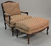 Louis XV style fauteuil with fitted ottoman.