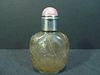 ANTIQUE CHINESE CARVED ROCK CRYSTAL SNUFF BOTTLE WITH PINK TOURMALINE STOPPER