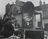 Robert Doisneau, (French, 1912-1994), Man with Phonograph, at Flea Market Paris