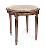 * A Louis XVI Style Occasional Table Height 29 1/2 x diameter 23 inches.