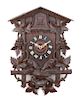 * A Black Forest Style Cuckoo Clock Height 33 inches.